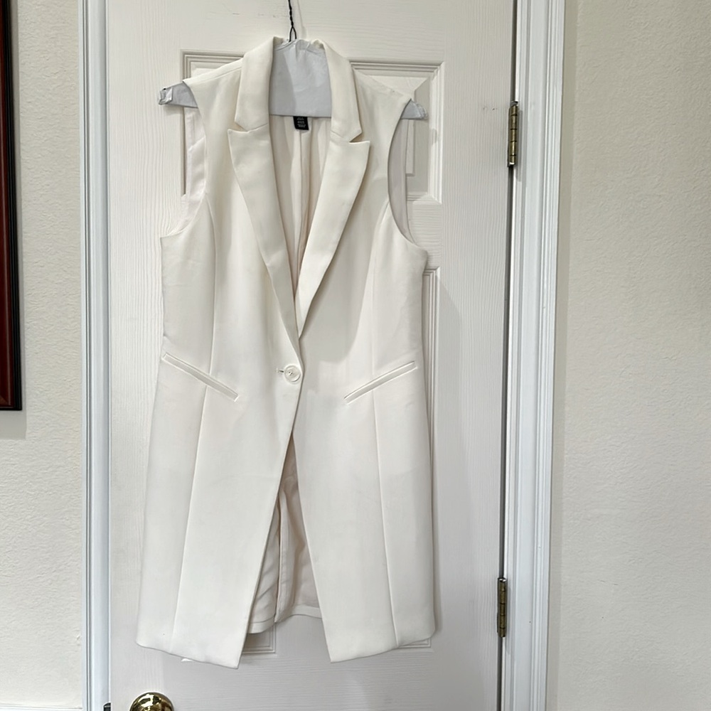 White House, black market Stylish White Sleeveless vest.